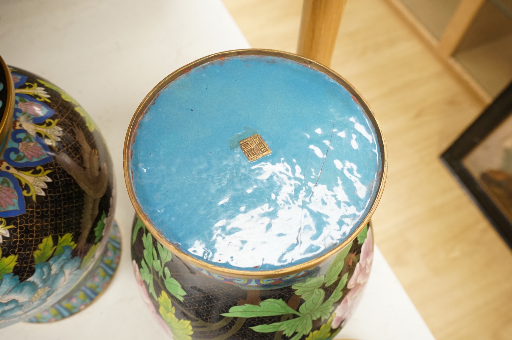 A pair of Chinese cloisonné baluster jars and covers decorated with birds and flowers, 38cm high